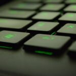 close up photography of black and green computer keyboard keys