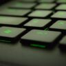 close up photography of black and green computer keyboard keys